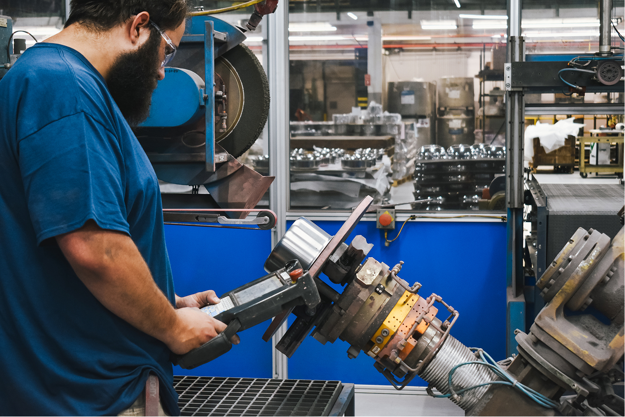 SynergyOps employee operating custom machinery